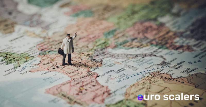 Small doll standing on world map