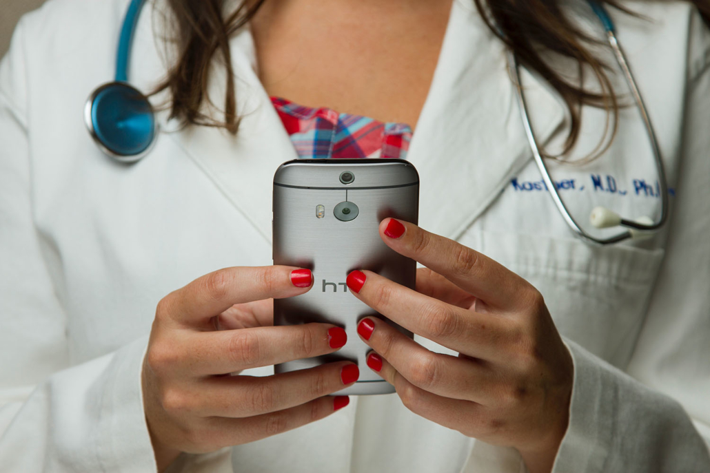 Medical doctor holding a phone