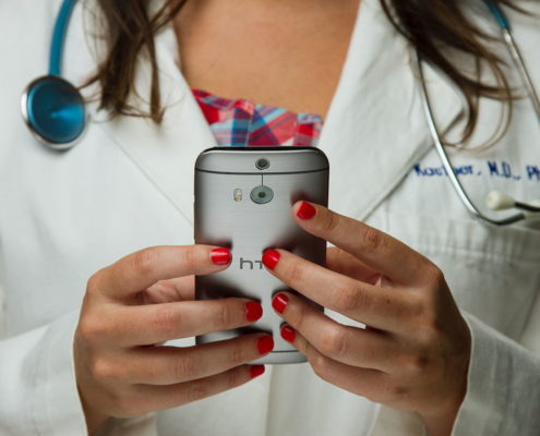 Medical doctor holding a phone