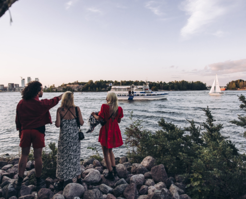 Three friends looking at sea in Tervasaari Island in Helsinki