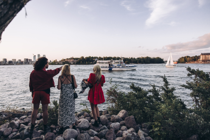 Three friends looking at sea in Tervasaari Island in Helsinki