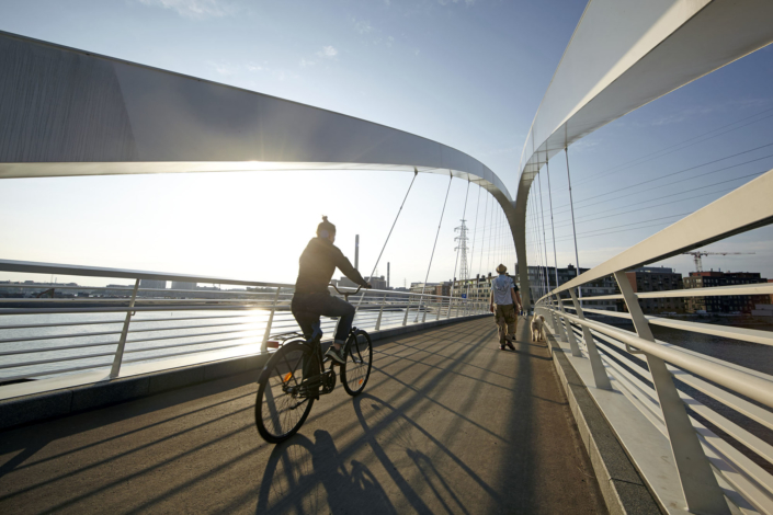 Cyclist on Grandpa's Bridge in Helsinki Kalasatama
