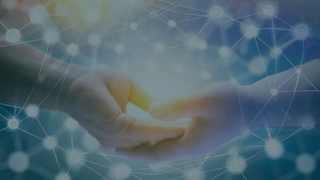 Two hands and a blue background with connected dots